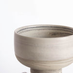 Close-up of the interior of a handmade ice cream bowl in earthy tones. 