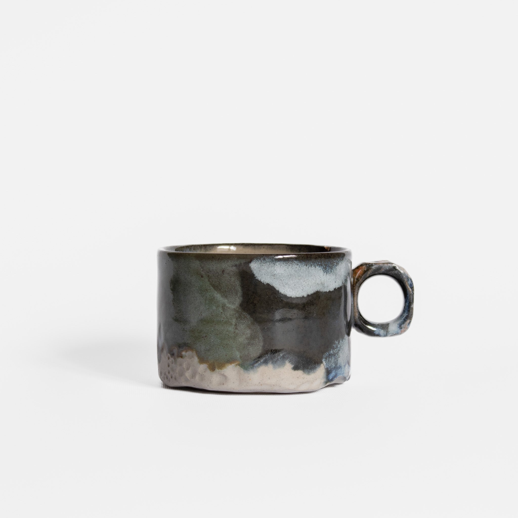 Ceramic mug with a textured surface on a white background