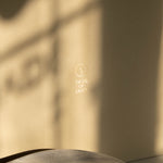 Warm beige Special Occasion Gift Box with a gold Made of Dust logo, shown in close-up.