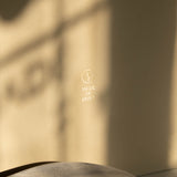 Warm beige Special Occasion Gift Box with a gold Made of Dust logo, shown in close-up.