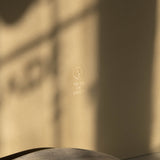 Warm beige Special Occasion Gift Box with a gold Made of Dust logo, shown in close-up.